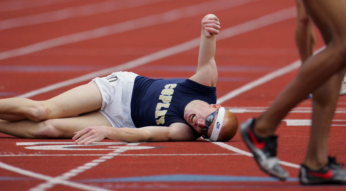 Third Place, George S. Smallsreed Photographer of the Year Award - Gus Chan / The Plain DealerCopley's Ryan Dezso falls after crossing the finish line in the Division 1 4X800 meter relay in Columbus, June 3, 2005. Copley finished third.  