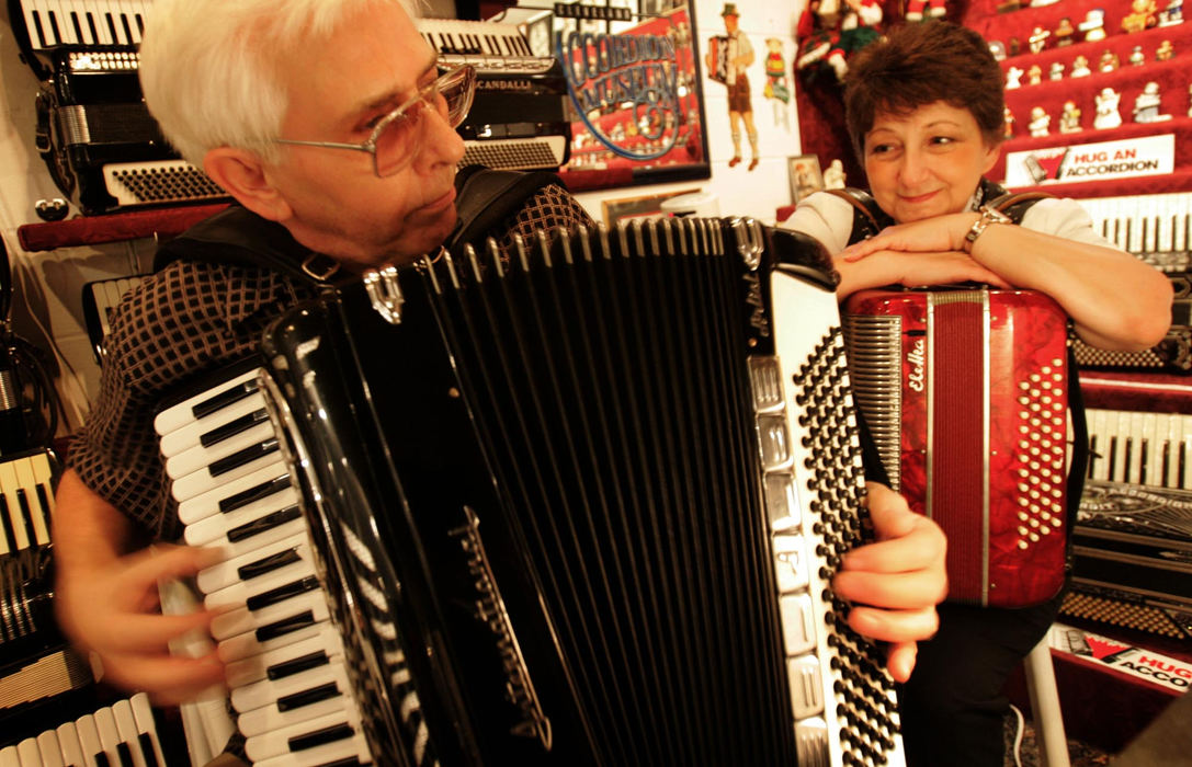 Award of Excellence, George S. Smallsreed Photographer of the Year Award - Dale Omori / The Plain DealerJack White plays the accordion in the basement of his home as his wife, Kathy, listens.  The Whites have turned the basement into the Cleveland Accordion Museum.                                 