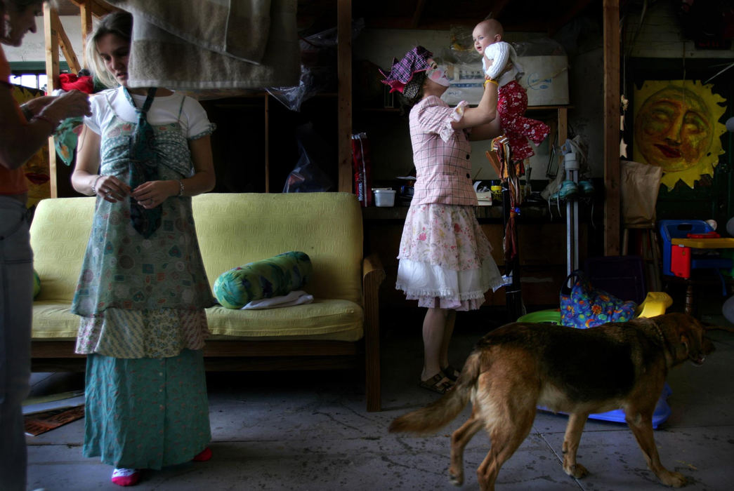 Award of Excellence, George S. Smallsreed Photographer of the Year Award - Dale Omori / The Plain DealerLizzie Roche holds daughter, Helen Mae, in the studio of Parade the Circle.  Roche is one of artists that make the floats and costumes for the annual event.  Every day her daughter accompanies her to work.