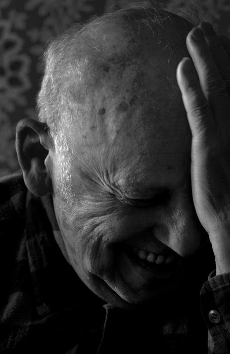 First place, George S. Smallsreed Photographer of the Year Award - Mike Levy / The Plain DealerHolocaust survivor Martin Czin laughs in his kitchen. 