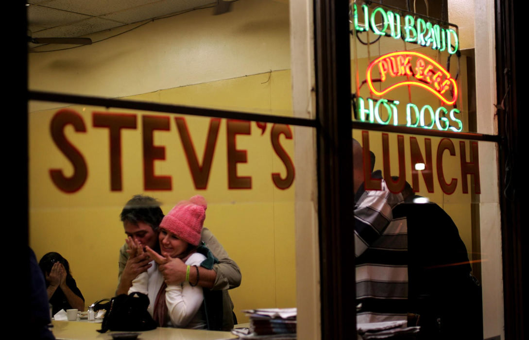 Award of Excellence, George S. Smallsreed Photographer of the Year Award - Dale Omori / The Plain DealerDimitris Ragousa and Tess Smith wait for their take out order at Steve's Lunch.