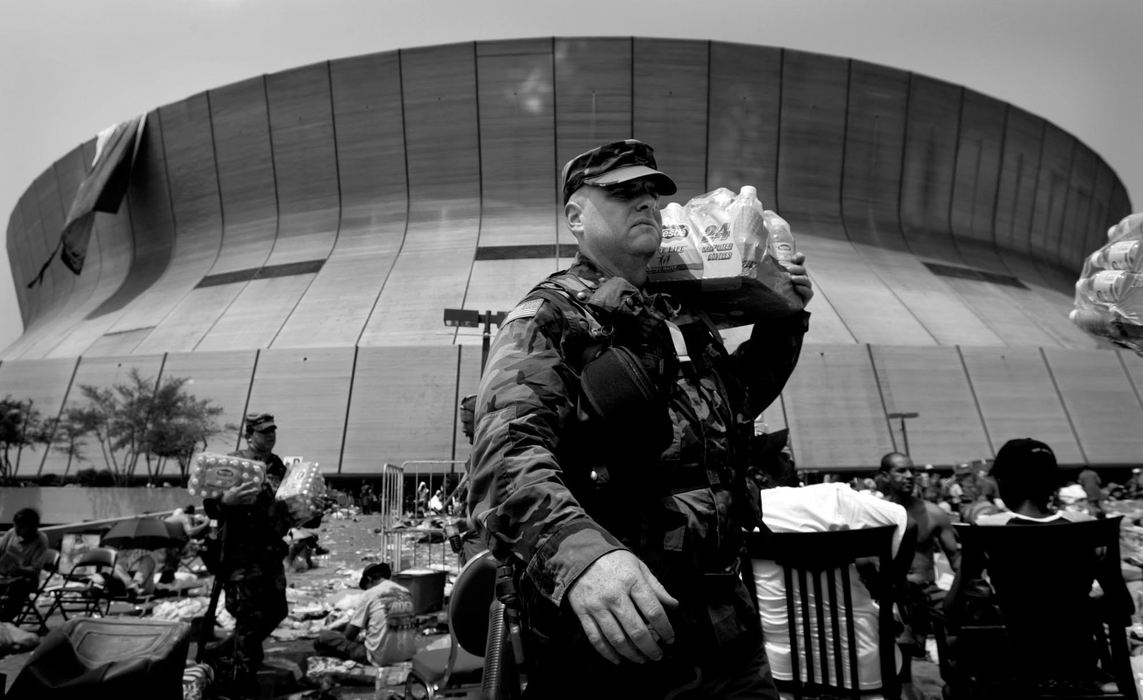 Award of Excellence, George S. Smallsreed Photographer of the Year Award - Dale Omori / The Plain DealerAn Ohio National Guardsman passes out water at the Superdome in New Orleans, La., in the aftermath of Hurricane Katrina.  