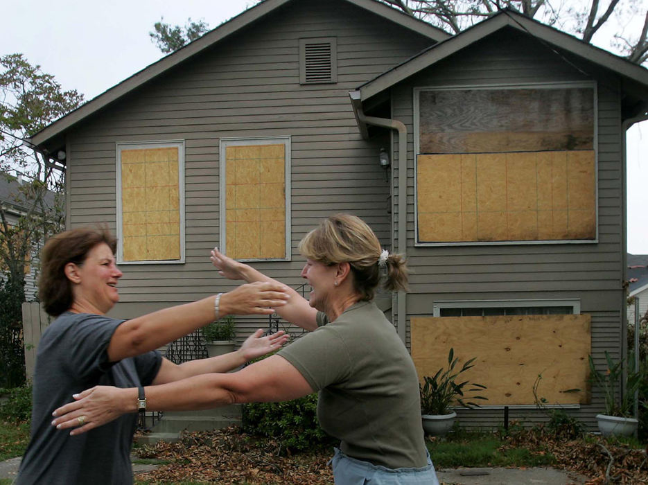 Award of Excellence, George S. Smallsreed Photographer of the Year Award - Dale Omori / The Plain Dealer Cindy Faison (left) welcomes neighbor Deb Piccolo as residents of Jefferson Parish outside of New Orleans returned to homes ravaged by Hurricane Katrina. 