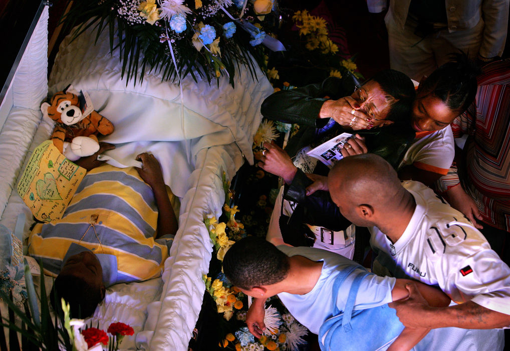 First place, George S. Smallsreed Photographer of the Year Award - Mike Levy / The Plain DealerFriends and family react during the viewing of 11-year-old Brandon Davis' body at Triedstone Baptist Church, Cleveland before Brandon's funeral service.  