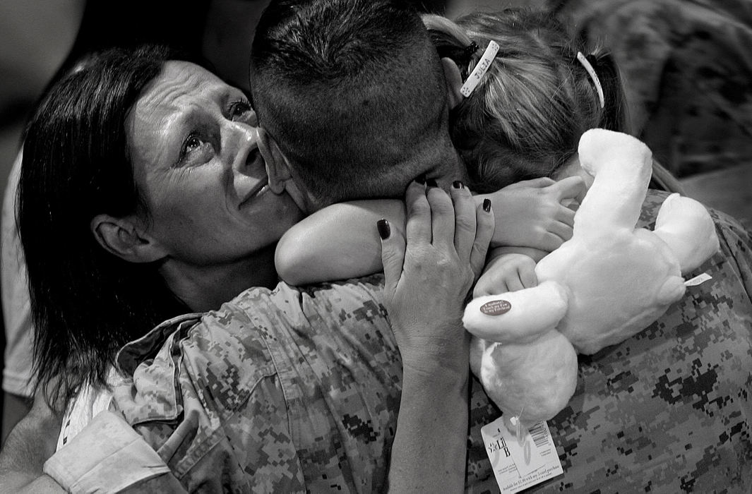 First place, George S. Smallsreed Photographer of the Year Award - Mike Levy / The Plain DealerApproximately 160 Marines and Sailors of Brook Park based headquarters and service Co. known as the 3/25 return to their families at the Brook Park Recreation Center.