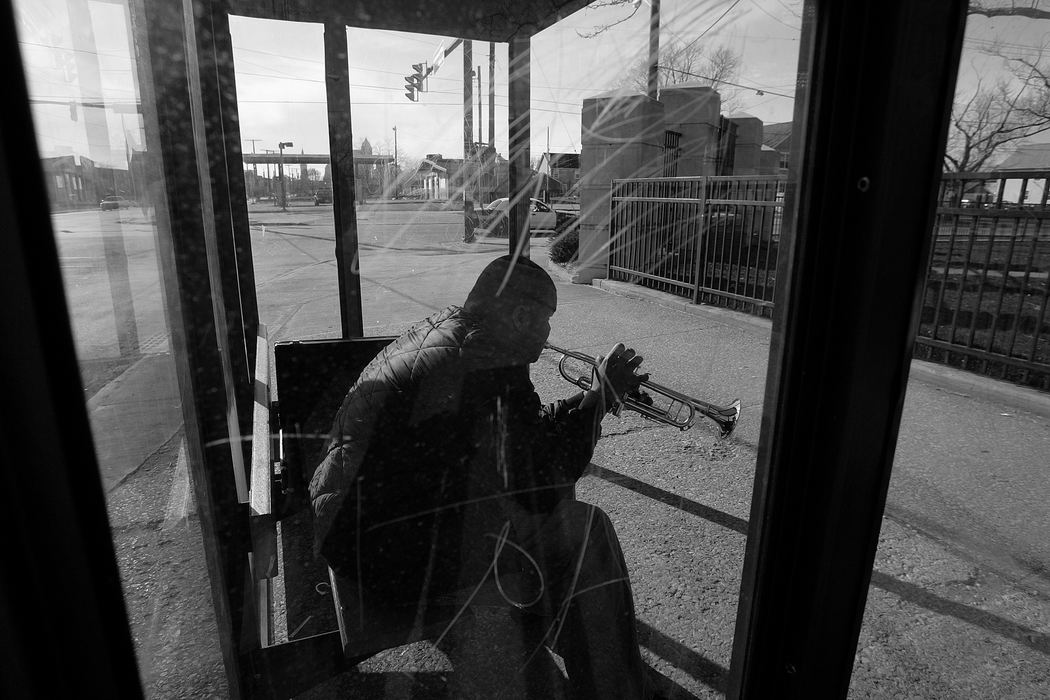 First place, George S. Smallsreed Photographer of the Year Award - Mike Levy / The Plain DealerDiontaie adames, 17, enroute to his aunt's place waits for the bus at the corner of E. 4oth and Community College.