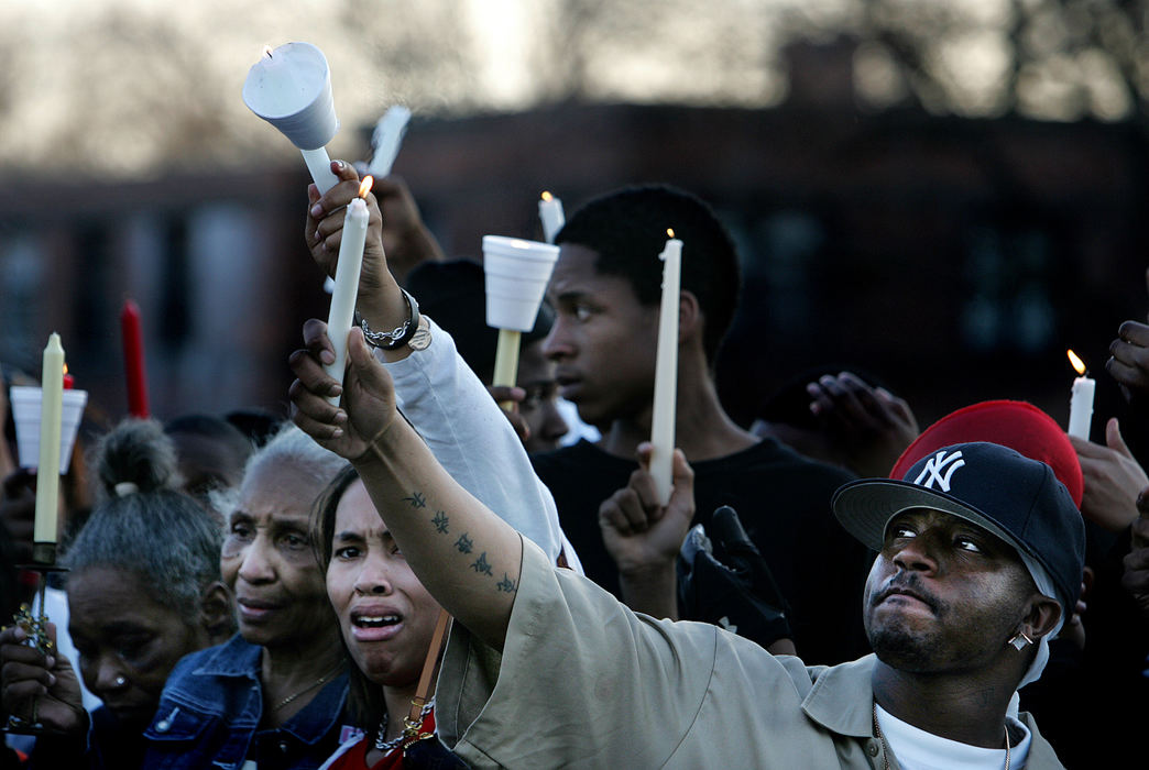 First place, George S. Smallsreed Photographer of the Year Award - Mike Levy / The Plain DealerA candle light vigil at the site of the Brandon Davis shooting attracted over 100 people, many from different Cleveland housing projects,  all with the same purpose, to stop the senseless violence.