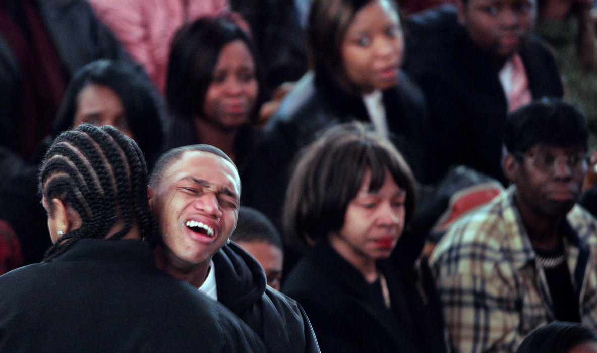 First place, George S. Smallsreed Photographer of the Year Award - Mike Levy / The Plain DealerFamily and friends filled the pews at the Shiloh Baptist Church, where they comforted each other during the funeral of Lennard Pinson, a 16-year-old freshman at East Tech High School in Cleveland. Lennard was fatally shot during a clash of rival neighborhood groups. Witnesses have said he was trying to make peace. 