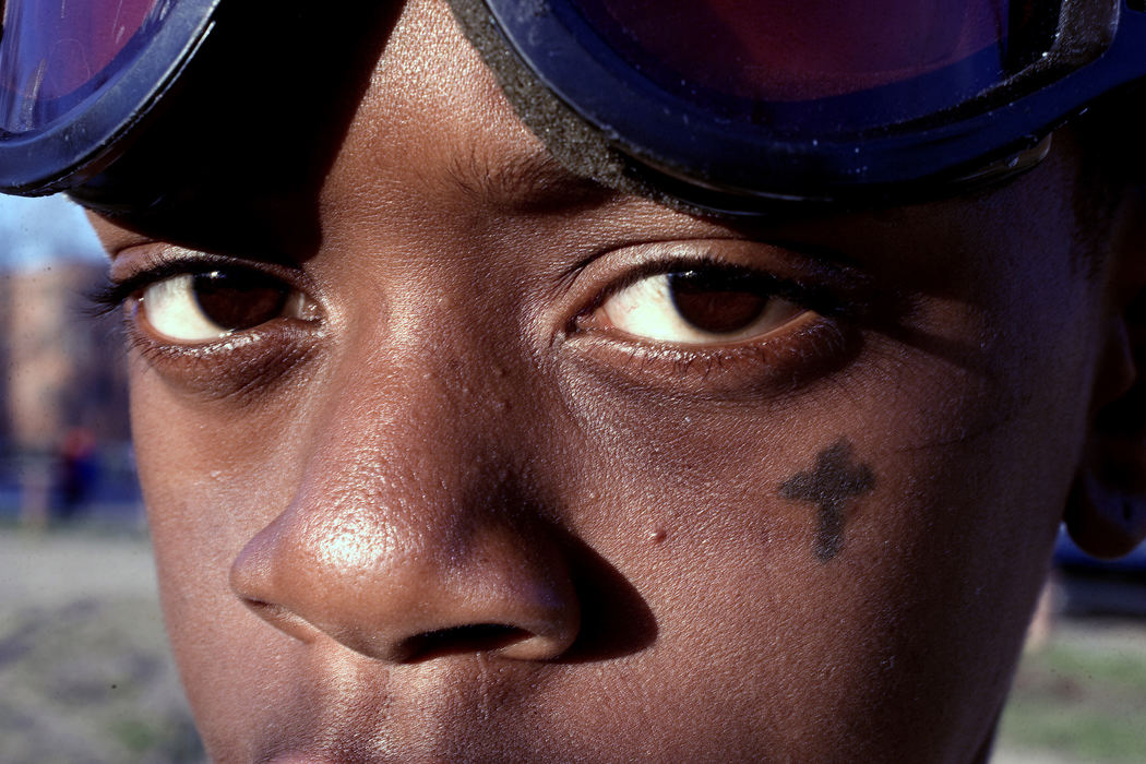 First place, George S. Smallsreed Photographer of the Year Award - Mike Levy / The Plain DealerEZ bares a tattoo on his cheek he is a member of a gang at the Outhwaite housing project.  He did not want me to photograph his whole face.