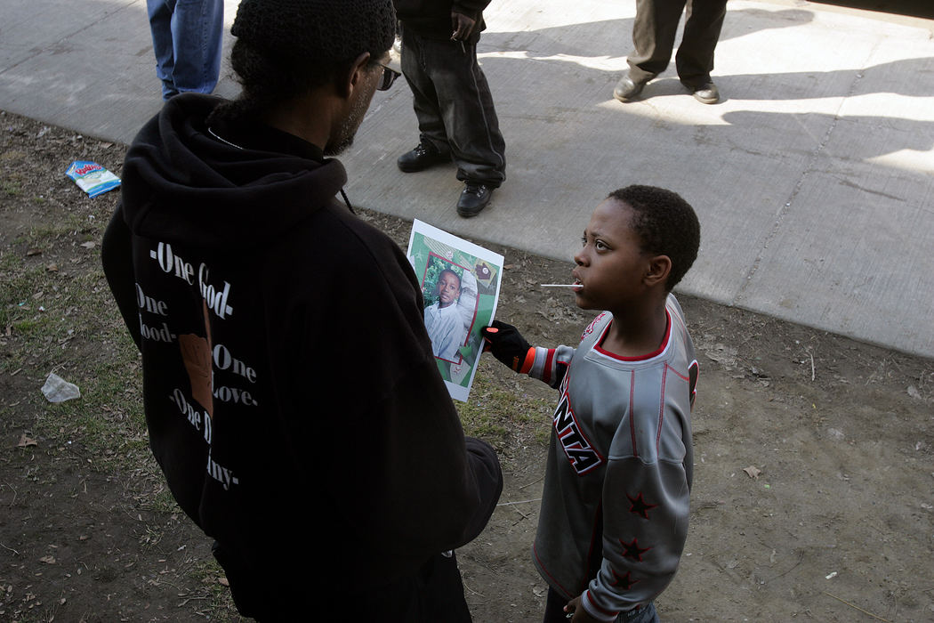 First place, George S. Smallsreed Photographer of the Year Award - Mike Levy / The Plain DealerCommunity peace activist Khalid Sammad  reaches out to the young people in the inner city of Cleveland.  