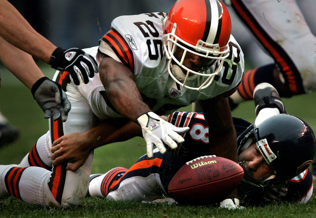 First place, George S. Smallsreed Photographer of the Year Award - Mike Levy / The Plain DealerSafety Chris Crocker, used more frequently on blitzes, recovers a fumble after his sack of Bears quarterback Kyle Orton (right) ending a Chicago drive with 2:37 left in the game. Two plays later, the Browns extended their lead to 20-10.