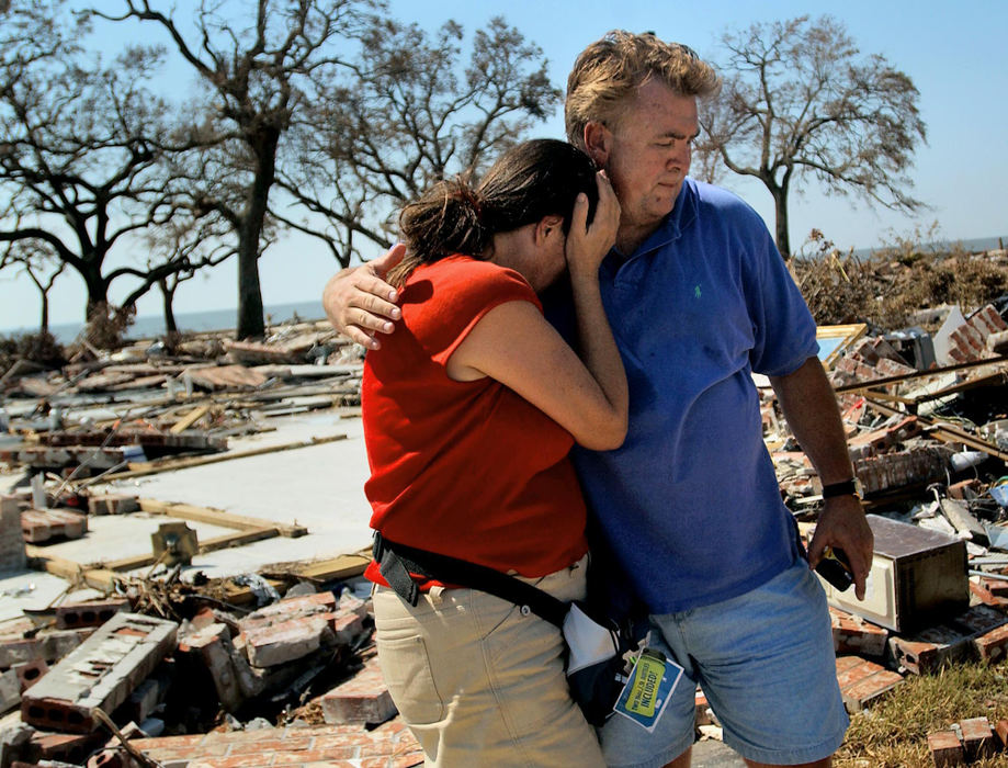 Second Place, George S. Smallsreed Photographer of the Year Award - Greg Ruffing / FreelanceAs Hurricane Katrina passed through the Gulf of Mexico, its severity was raised to a category 5, the highest ranking. Headed straight towards New Orleans, the storm took a last-minute turn to the east, and the eye of the storm struck just west of Waveland, Miss., on the morning of 29 August 2005. "I've lost everything!" laments a weeping Peggy Smith (in red) as she is comforted by a neighbor who wished to not be identified, after viewing the remains of her house in Long Beach, Miss. 