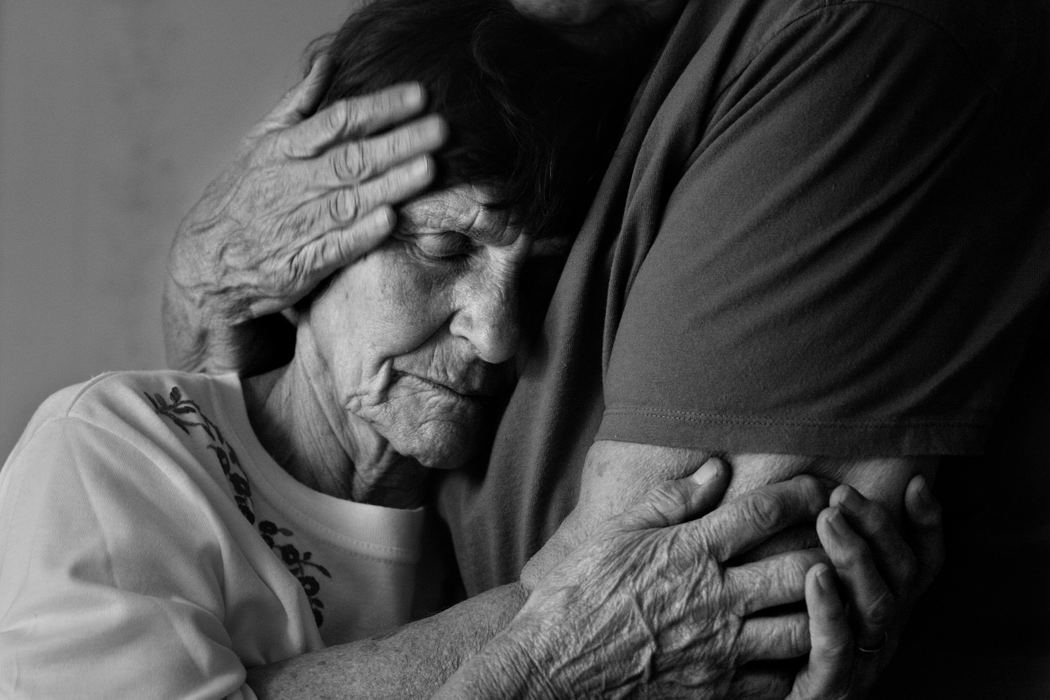 First place, George S. Smallsreed Photographer of the Year Award - Mike Levy / The Plain DealerRose Immke is comforted by her sister-in-law, Rose West at Rose's home in Pepper Pike. Rose's husband, Lloyd Immke has not been seen for almost two weeks since he walked away from her daughter's Mentor home.  