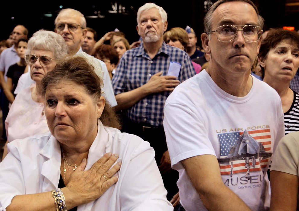 Second Place, George S. Smallsreed Photographer of the Year Award - Greg Ruffing / FreelancePeople in the crowd listen as Taps is played during a memorial service for fallen Marines at the International Exposition Center in Cleveland. Thousands attended the service to honor the 20 Marines from the nearby Brookpark-based 3rd Battalion, 25th Regiment, who were killed in Iraq in August.