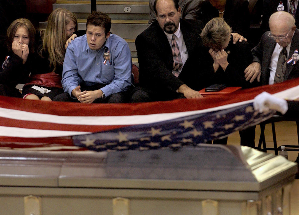 Second Place, George S. Smallsreed Photographer of the Year Award - Greg Ruffing / FreelanceThe family of Lance Cpl. Timothy Bell Jr. react as Marines fold the flag from his casket during a public memorial service at his alma mater, Lakota East High School in West Chester.