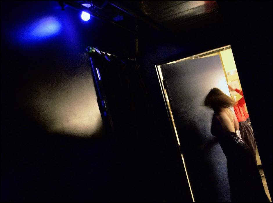 Second Place, George S. Smallsreed Photographer of the Year Award - Greg Ruffing / FreelanceCast member Carrie Lynn McDonald hurries from the dressing room to the stage after a quick costume change during a showing of "Sex at the Box" at the Shadowbox Cabaret in Columbus. 