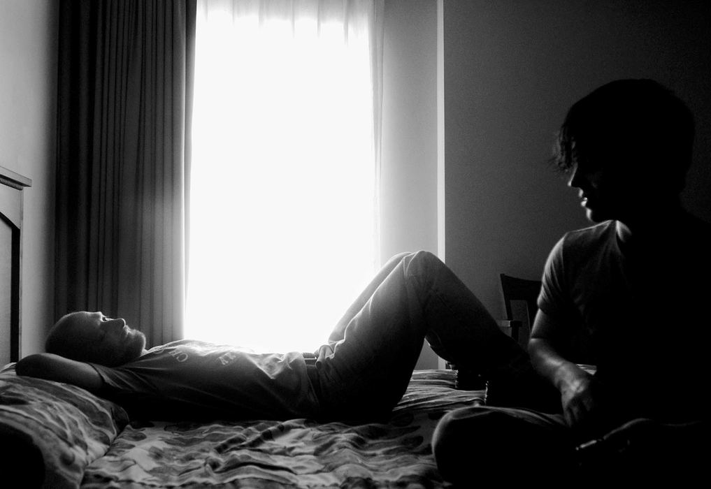 Second Place, George S. Smallsreed Photographer of the Year Award - Greg Ruffing / FreelanceIn Reno for the arm wrestling World Championship in October, Boomer (right) and his father Willie relax in their hotel room the day before competition, trying to ignore the hunger pangs in their stomachs and not eat anything before the official weigh-ins that evening. 