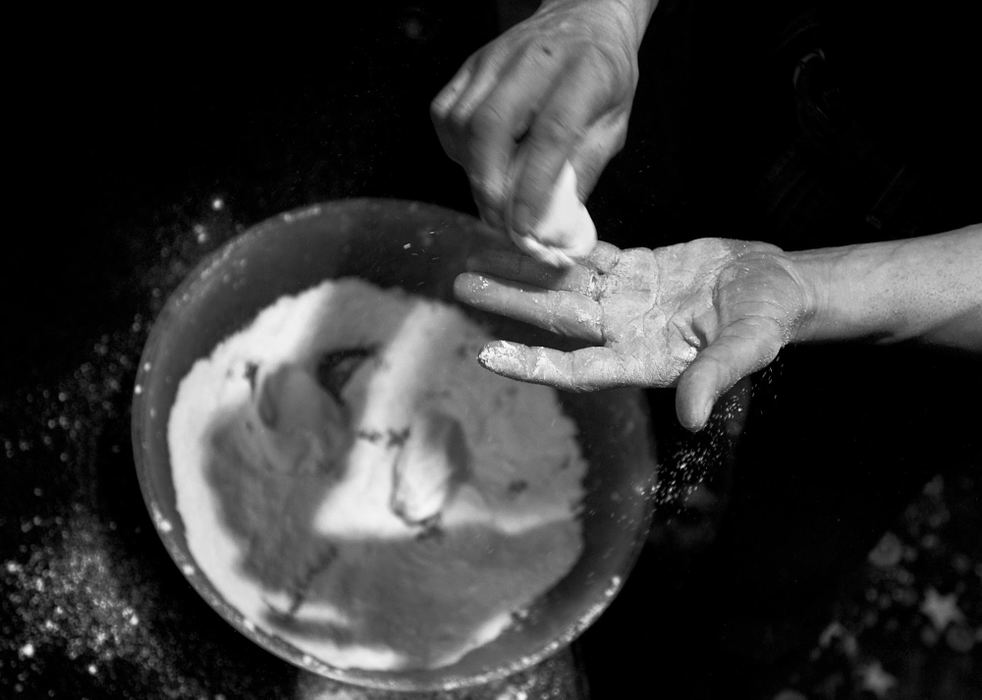 Second Place, George S. Smallsreed Photographer of the Year Award - Greg Ruffing / FreelanceWillie chalks up his hands before a match. Arm wrestlers use the chalk to improve grip while pulling; if a competitor's hand slips during the match, the referee will stop the match and bind the competitors' hands together with a tight velcro strap before restarting. 