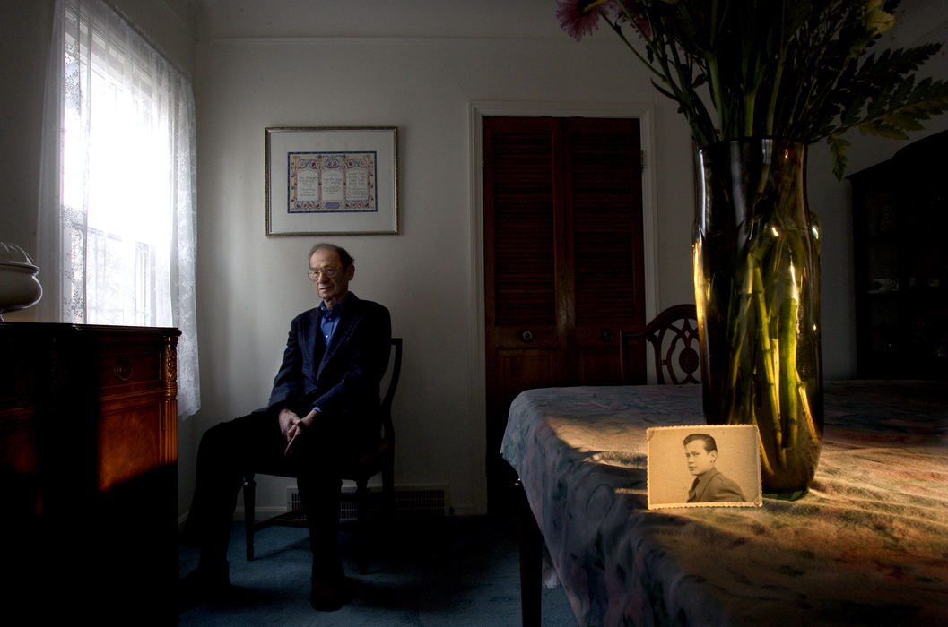 First place, George S. Smallsreed Photographer of the Year Award - Mike Levy / The Plain DealerDr. Zev Harel, holocaust survivor with picture of himself after he was released from the Nazies. Photographed at his home in University Heights.  .