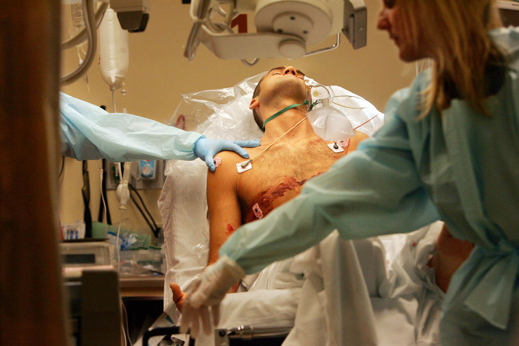 Third Place, George S. Smallsreed Photographer of the Year Award - Gus Chan / The Plain DealerA shooting victim is attended to by nurses in the emergency room.