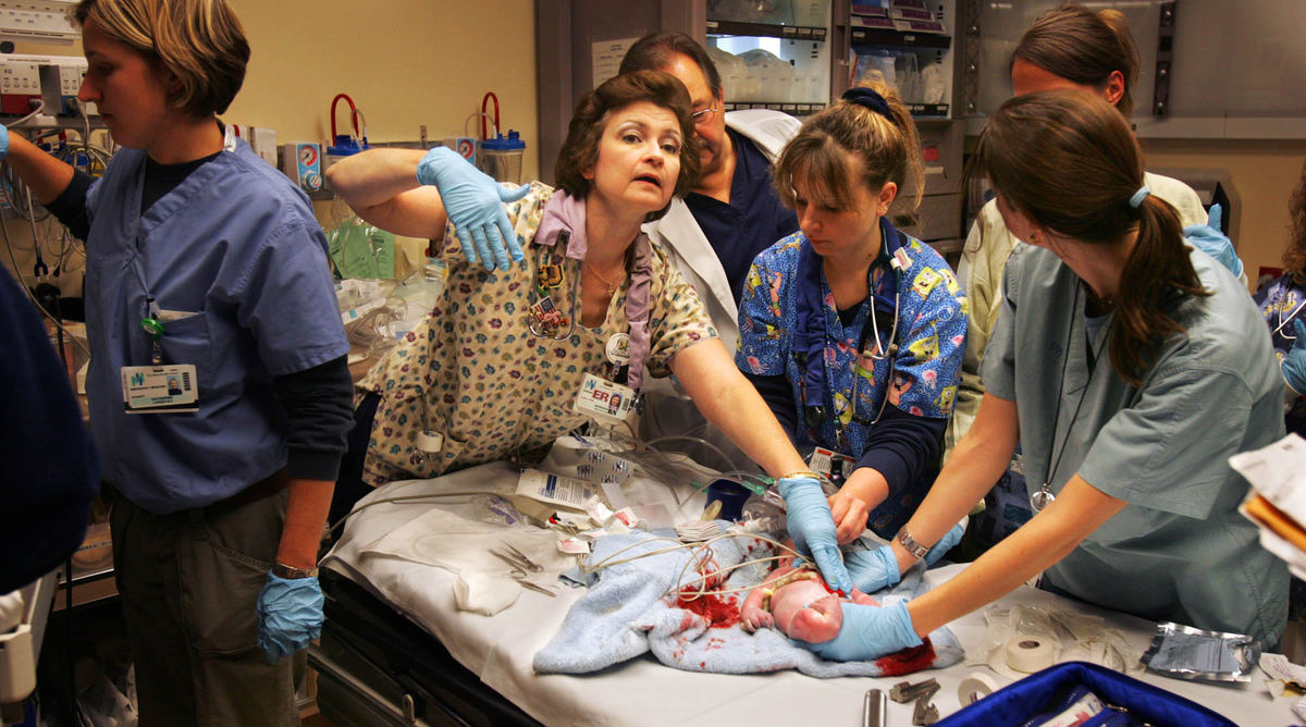 Third Place, George S. Smallsreed Photographer of the Year Award - Gus Chan / The Plain DealerAn emergency nurse tends to a heroin addicted newborn going through withdrawal.