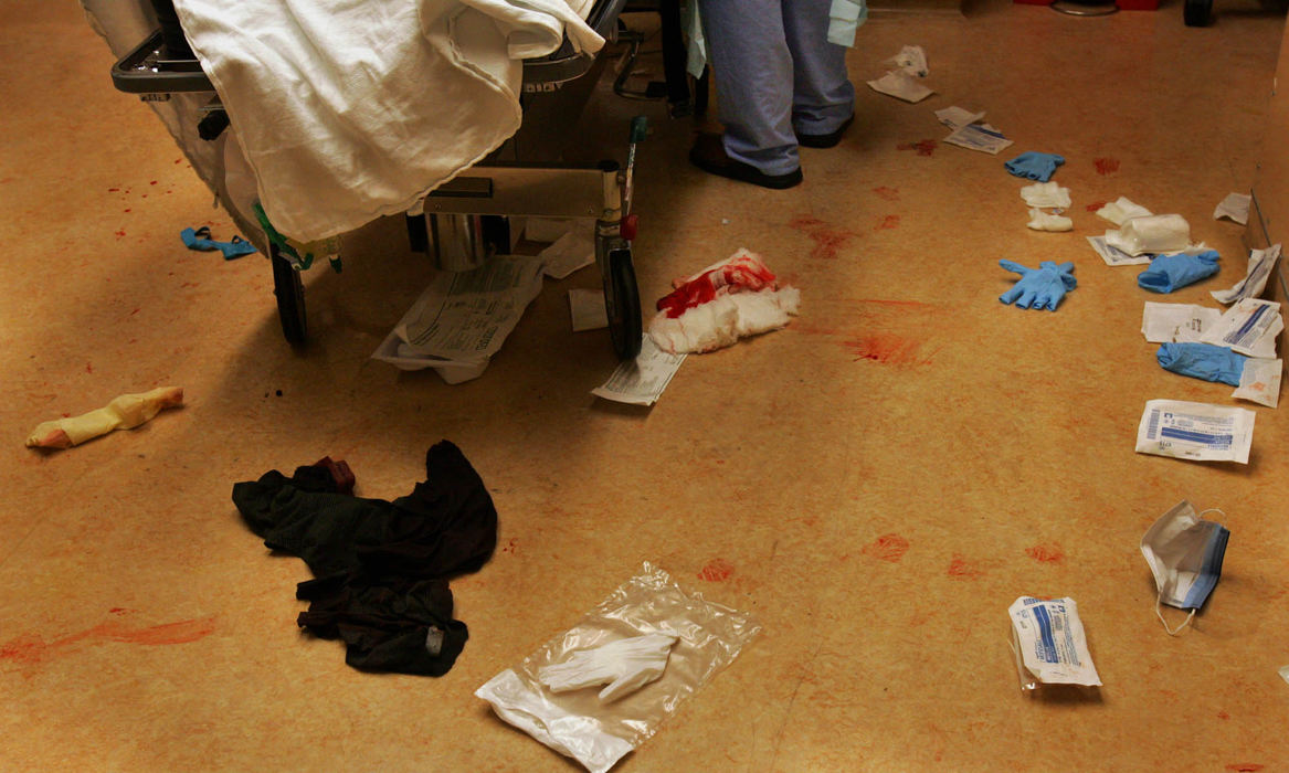 Third Place, George S. Smallsreed Photographer of the Year Award - Gus Chan / The Plain DealerThe floor of the emergency room during treatment of a trauma patient.