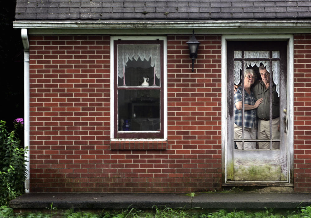 Award of Excellence, Portrait/Personality - Chris Russell / The Columbus DispatchFarley and Joyce Amos were forced to sell this home and their peat farm because of debts to the Ohio Farm Bureau after turning to the Bureau for help with EPA restrictions on their ability to harvest peat from their property.   