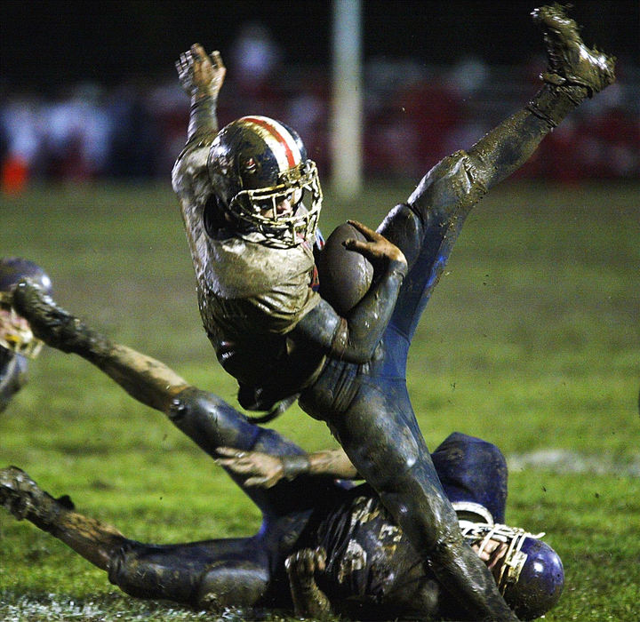 Award of Excellence, Sports Action - Chris Parker / ThisWeek NewspapersGrove City's Nick Boden gets upended at Pickerington Central High School, Oct. 7, 2005.