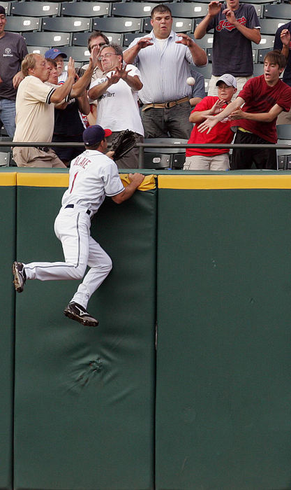 Award of Excellence, Sports Action - Mike Levy / The Plain DealerCleveland Indians' Casey Blake climbs the right field wall in vain as Cliff Lee's first pitch was hit by Royal's David DeJesus out of the park for a first inning home run.  