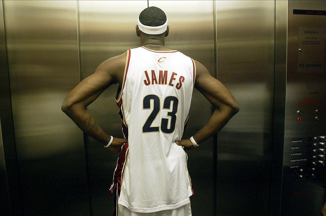 Award of Excellence, Sports Feature - Andy Wrobel / Medina GazetteCleveland Cavaliers' star LeBron James shows off his muscles as he goofs around with his reflection in the stainless steal elevator doors in the Quicken Loans Arena during the team's media day on October 3, 2005.