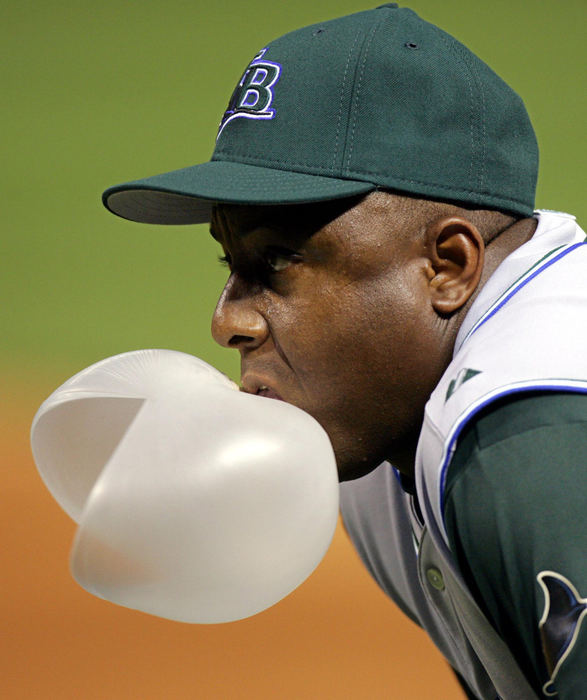 Award of Excellence, Sports Feature - Mark Duncan / Associated PressTampa Bay Devil Rays first base coach Billy Hatcher has his bubble burst in the fourth inning against the Cleveland Indians, Aug. 12, 2005, in Cleveland.