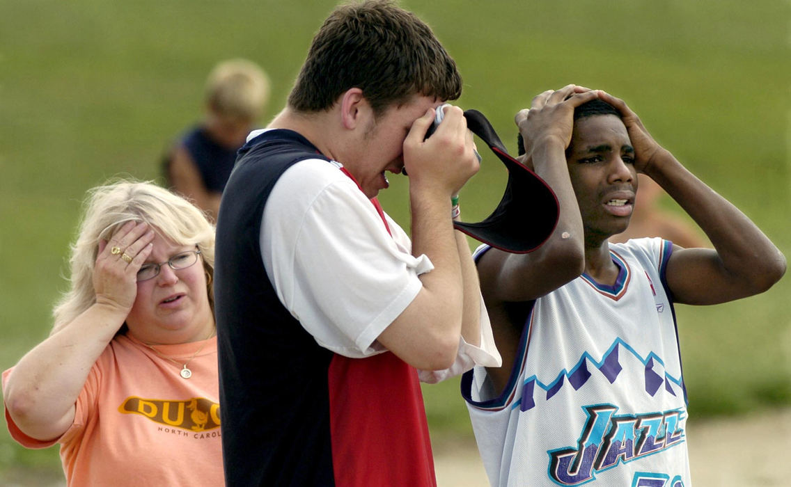 Award of Excellence, Spot News under 100,000 - Marsahll Gorby / Springfield News-SunFriends of 14-year-old Darius Johnson react to the drowning death of the teen at Buck Creek State Park. The boys had been swimming with Johnson when he went under the water. The teen, who was in a group home for troubled youth, was pulled from the water later that day.