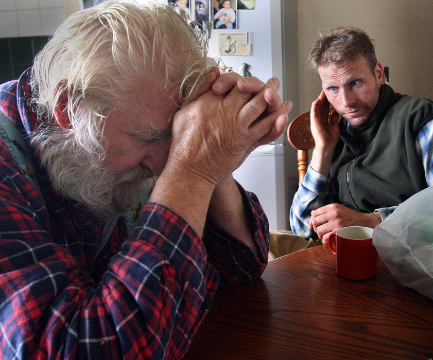 First place, Student Photographer of the Year Award - Katie Falkenberg / Ohio UniversityNeil Ross' father, Don Ross (left) is becoming too old to continue to run the farm, so Neil is slowly taking over by doing most of the farming these days. Here they discuss what work needs to be done today on the farm. Don and his wife gave birth to Neil in the same house they still live in and Neil learned how to farm from his father as he was growing up.