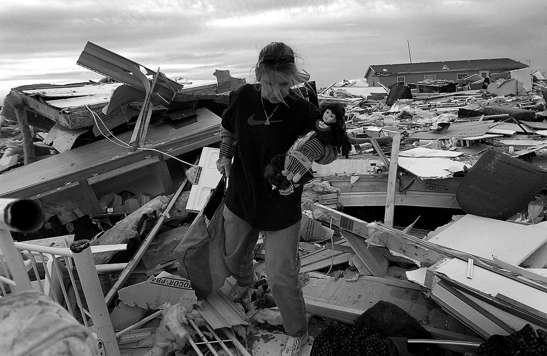 Award of Excellence, Student Photographer of the Year Award - Sung H. Jun  / Ohio UniversityRebecca Valentine found her daughter's favorite doll among the ruins of her boyfriend's mobile home. Residents and family of the Eastbrook Mobile Home Court were allowed back into the park to gather belongings. Valentine was trapped by a water heater after the tornado hit.  Tornado victims, Rebecca Valentine and her boyfriend Tony Mitchell lost their home in a tornado on November 6th, which killed 20 of their neighbors in Evansville, In. After five weeks, they move into a new trailer home a couple of blocks away from their old home.   