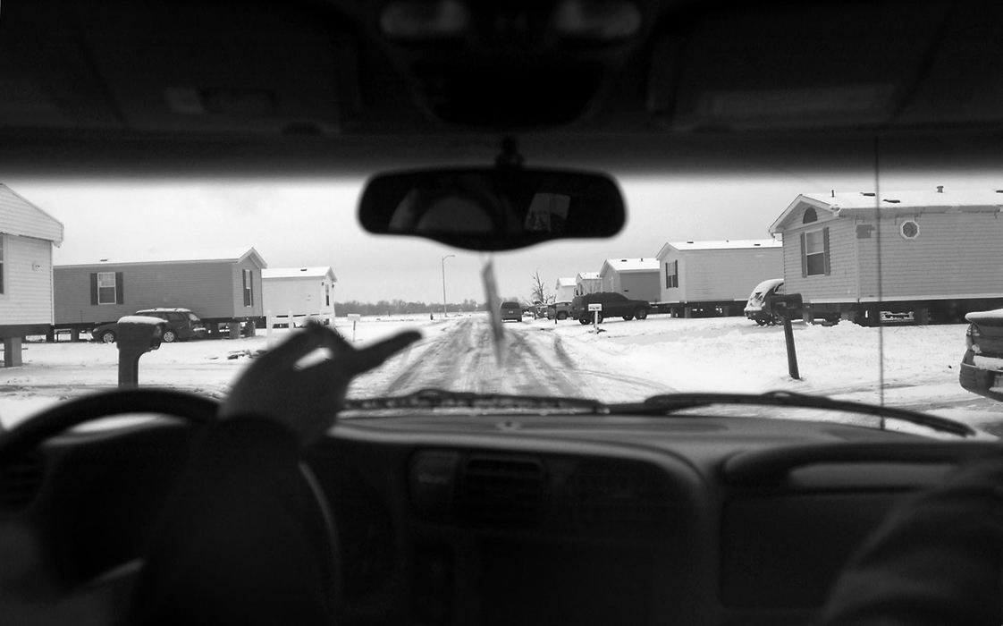 Award of Excellence, Student Photographer of the Year Award - Sung H. Jun  / Ohio UniversityRebecca Valentine, left, and Tony Mitchell head to a mobile home that they purchased located in Eastbrook Mobile Home Park. Valentine is still scared to move back into a trailer after surveying the Nov, 6th tornado. However, she and Mitchell purchased a new trailer a couple of blocks away from their old home. Mitchell wanted to move back into Eastbrook because he enjoys living there.