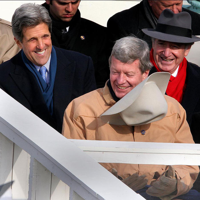 First place, Student Photographer of the Year Award - Katie Falkenberg / Ohio UniversitySenator John Kerry (D-MA), provides a moment of levity as he jokes with fellow Senator Max Baucus (D-MT) about his cowboy hat. Kerry finally quickly flipped it off Baucus's head to jokingly provide himself with a better view. Senator Tom Harkin (D-IA) laughs with them as they wait for President George W. Bush’s second inauguration to begin. 