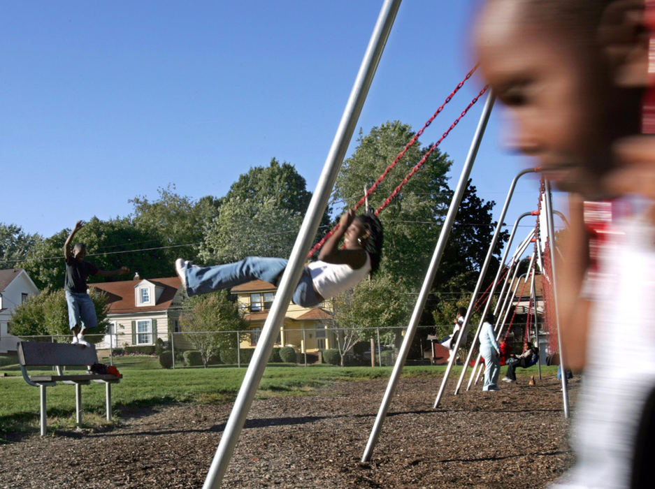 Second Place, Student Photographer of the Year Award - Emily Rasinski / Kent State UniversityKevon Ballard, 5, swings with his sister Tierra, 13, and cousin Michael at the neighborhood park.  The kids go to the park to hang out and be around kids their own age.  The kids still have not made contact with their friends from New Orleans and have no idea where they are.