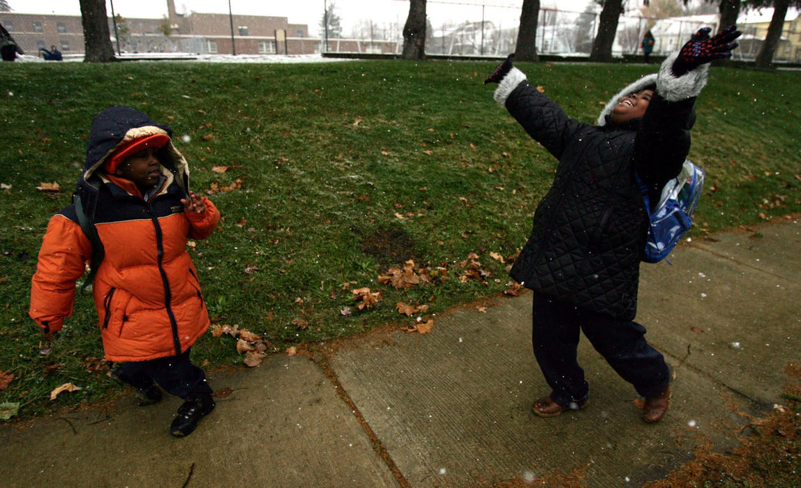 Second Place, Student Photographer of the Year Award - Emily Rasinski / Kent State UniversityAfter living in Akron for three months Sebrea and her brother Kevon celebrate seeing their first snow ever as they walk home from school.  No one from the family had ever experienced snow before.  