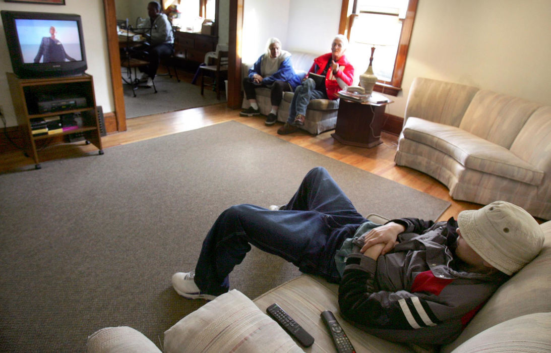 Second Place, Student Photographer of the Year Award - Emily Rasinski / Kent State UniversityJoey watches a movie in the Family Center while his parents call apartments.  The family stays at the Family center from 8 a.m. to 4 p.m. and is able to use all its facilities.  Joey typically rents three movies a day from the library and spends his days watching them.