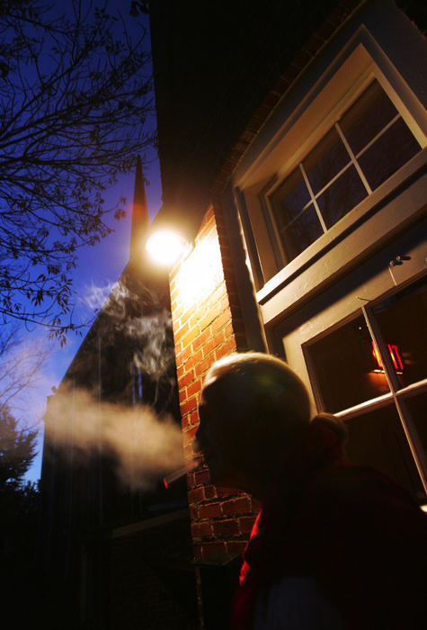 Second Place, Student Photographer of the Year Award - Emily Rasinski / Kent State UniversityJoseph takes a smoke break with his son Joey outside the church.  While smoking the two talk about possible jobs Joey, who's interested in computers or janitorial work, could get. 