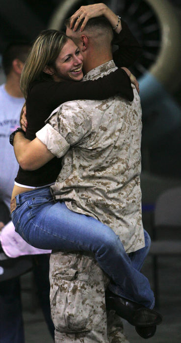 Second Place, Student Photographer of the Year Award - Emily Rasinski / Kent State UniversityLinda Hallock jumps into the arms of her boyfriend Anthony Congemi at the Akron Canton Airport, October 7, 2005. Hallock hadn't seen her boyfriend since he was deployed to Iraq in January. 