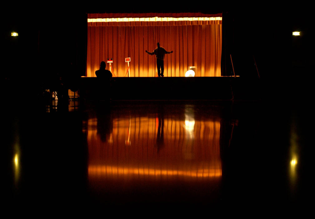 Third Place, Student Photographer of the Year Award - Michael P. King / Ohio UniversityDyris Haywood (center) who plays "Pookie" in "Robin's Hood: A Hip-Hopera," rehearses in front of director Omowale Akintunde, left, on the Lincoln Elementary School stage, April 26, 2005.