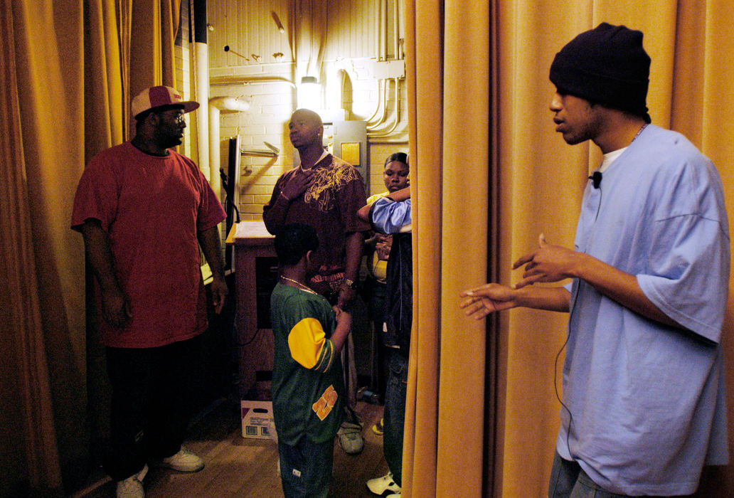 Third Place, Student Photographer of the Year Award - Michael P. King / Ohio UniversityWith only a few days before the final performance, the pressure to succeed is felt by cast members (from left) Devin Wilson, Lindsey Baxter, Trey Norman, Veronica Hands, and Malcom Lipson as they wait backstage as Smith prepares himself for rehearsal April 26, 2005. Norman, who plays the lead role, holds his chest while suppressing a cough – he came down with an illness the week of the final performance.