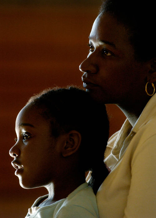 Third Place, Student Photographer of the Year Award - Michael P. King / Ohio UniversityParents would often come to watch the progress at rehearsals. Marcia Haywood and her daughter Hya, 4, sit together and watch a rehearsal at Lincoln Elementary on April 12, 2005. Haywood's son Dyris, 12, plays "Pookie" in the hip-hopera.