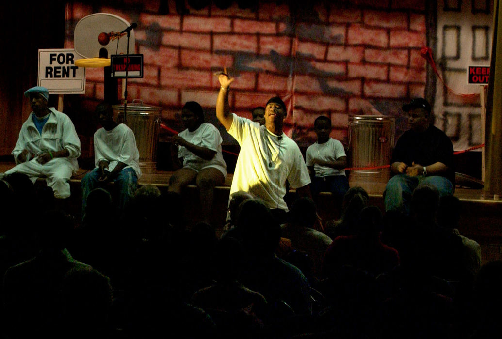 Third Place, Student Photographer of the Year Award - Michael P. King / Ohio UniversityLead performer Trey Norman raps in the spotlight during the night of the performance at Lincoln Elementary, April 30, 2005. 