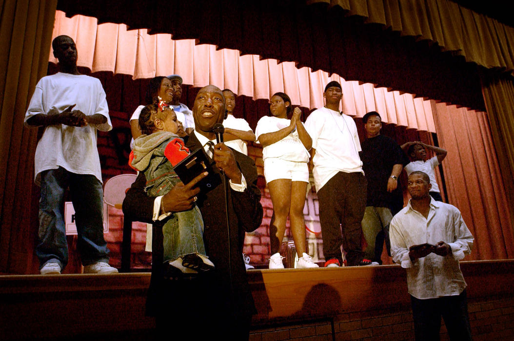 Third Place, Student Photographer of the Year Award - Michael P. King / Ohio UniversityWith the cast of "Robin's Hood: A Hip-Hopera" behind him, director Omowale Akintunde addresses his thanks and appreciation to the audience following the production's final performance at Lincoln Elementary, April 30, 2005. 