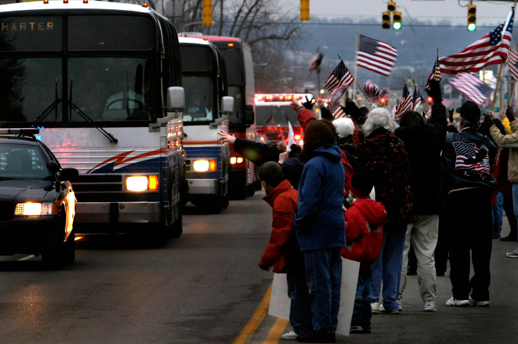 Third Place, Student Photographer of the Year Award - Michael P. King / Ohio UniversityCitizens of Chillicothe and other nearby Ohio towns gather in the middle of E. Main Street in Chillicothe near the municipal buildings on February 11, 2005, to welcome the soldiers of the Ohio National Guard 216th Engineer Battalion Alpha Company home from Camp Atterbury, Ind.