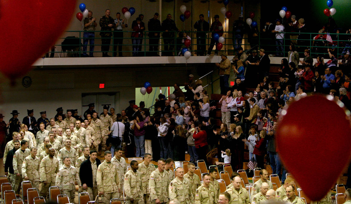 Third Place, Student Photographer of the Year Award - Michael P. King / Ohio UniversityThe 90 soldiers of the Ohio National Guard 216th Engineer Battalion Alpha Company enter Chillicothe's Shoemaker Center to a standing ovation. Three of the unit's men were killed in action. 