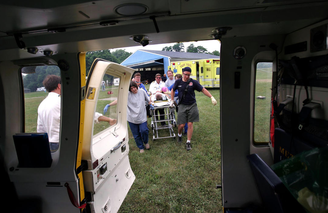 Award of Excellence, Student Photographer of the Year Award - Sung H. Jun  / Ohio UniversityMetro Life Flight staff and firefighters of  Troy Township move the trauma victim to helicopter. 