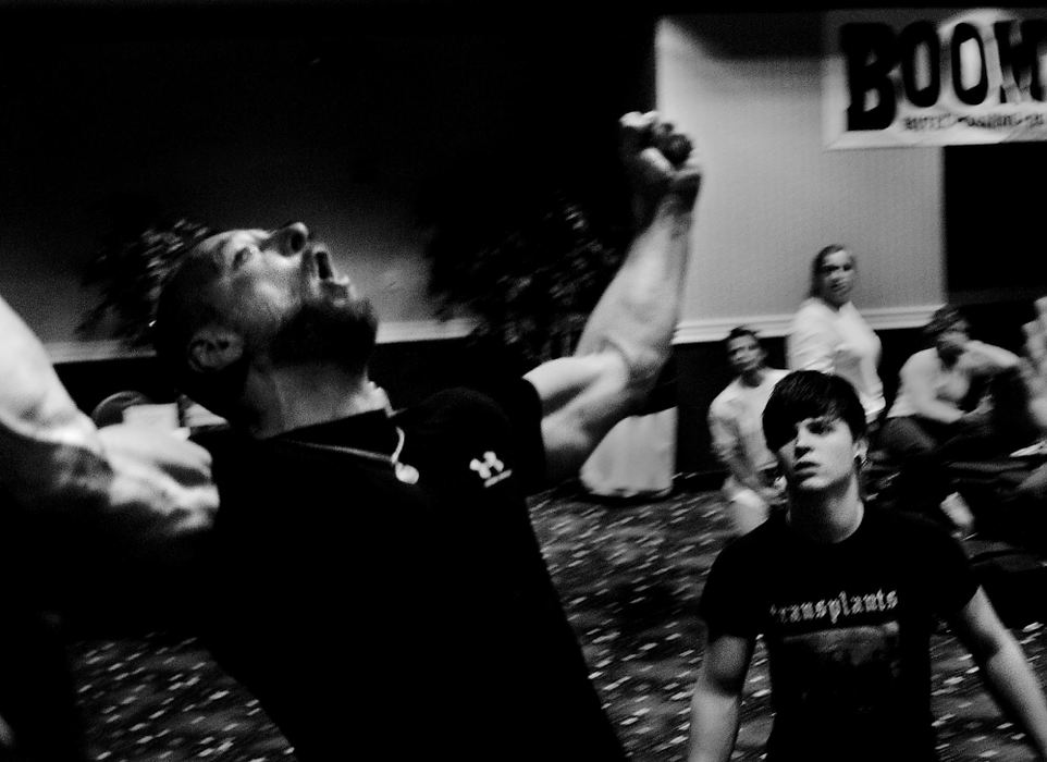 First place, Sports Picture Story - Greg Ruffing / FreelanceWillie (left) celebrates after winning a World Championship gold medal in the Masters division 154-pound left-hand class. His son Boomer is at right. "Nobody went through what I did (mentally)," he said. "I wanted it (the gold medal) the most, and it was all worth it." But the win would be bittersweet for Willie because Boomer came up short in defending his own gold medal from last year. "I love my boy, I know he's disappointed," Willie would later say. "Its anybody's day on that (arm wrestling) table."